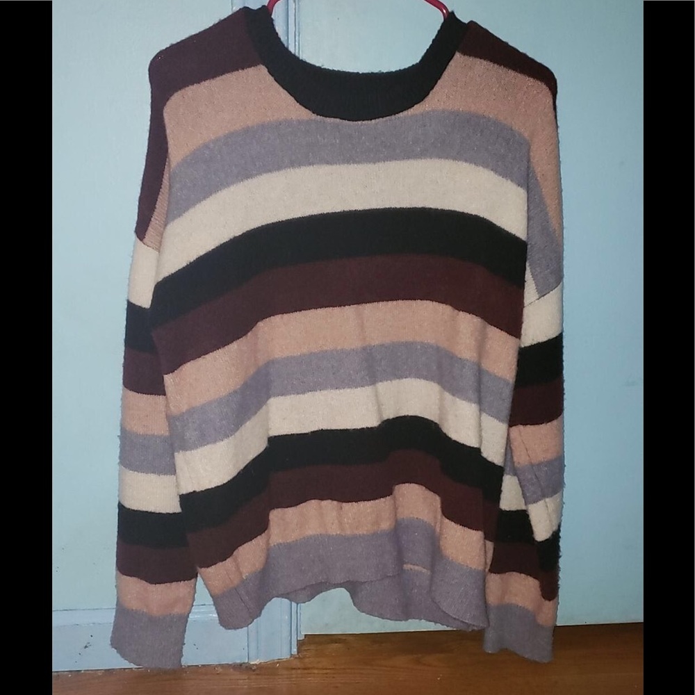 A blu,white, and pink sweater